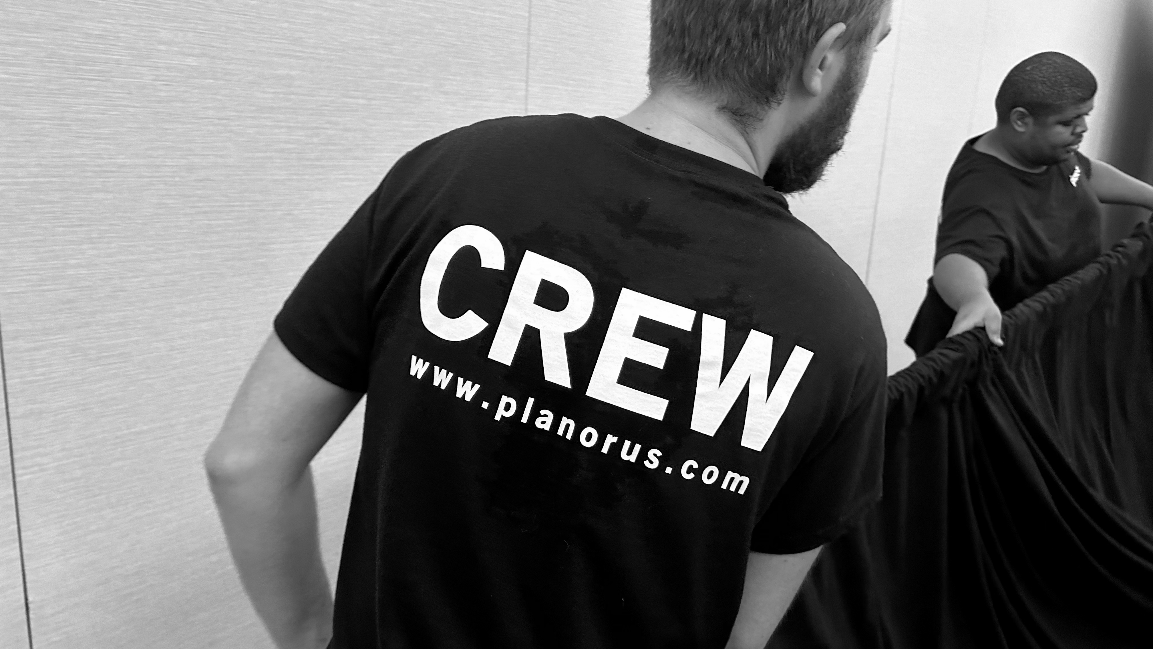 A pair of Planorus's audiovisual technicians hard at work